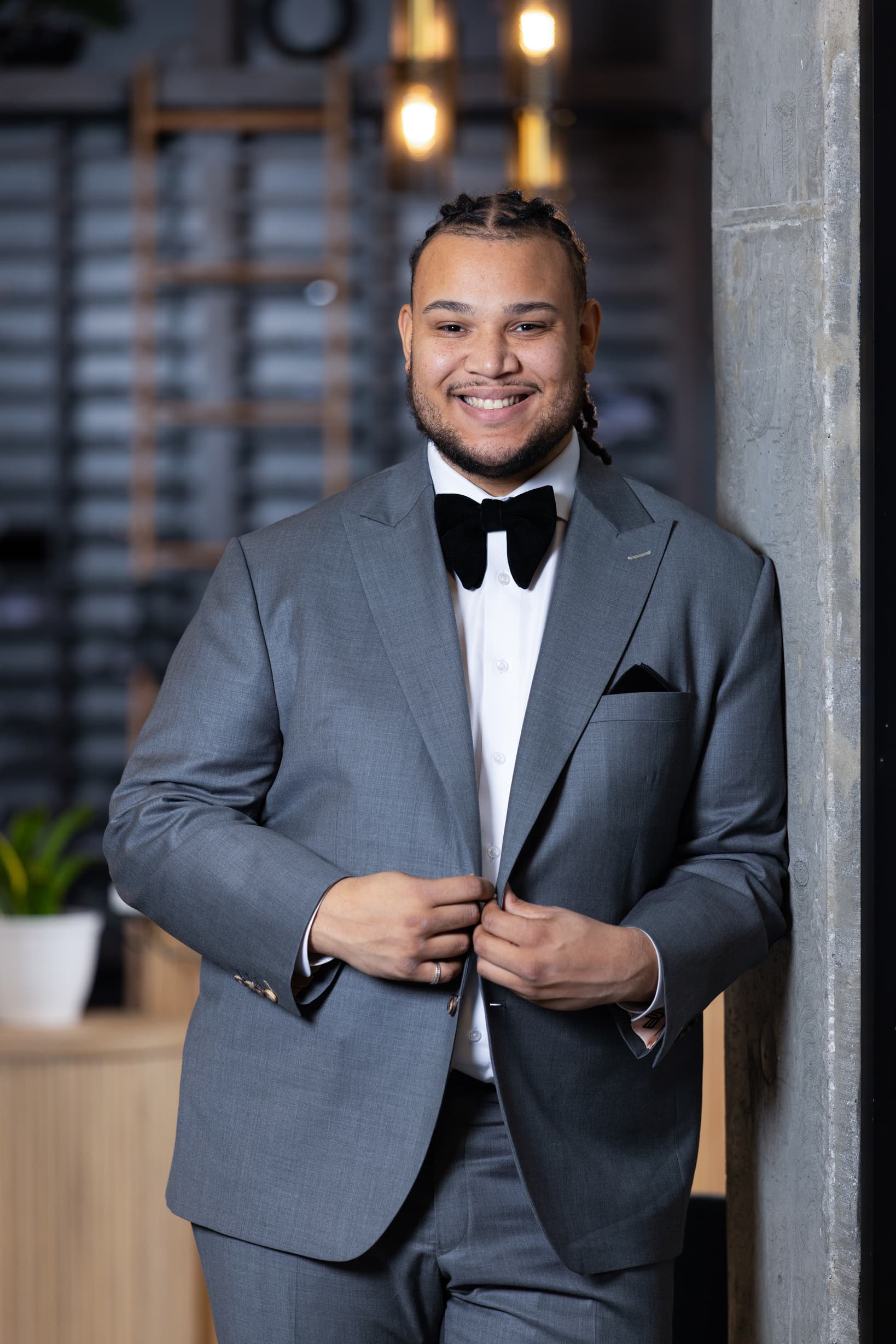 Carter McKinney, founder of McKinney Media, smiling in a gray suit